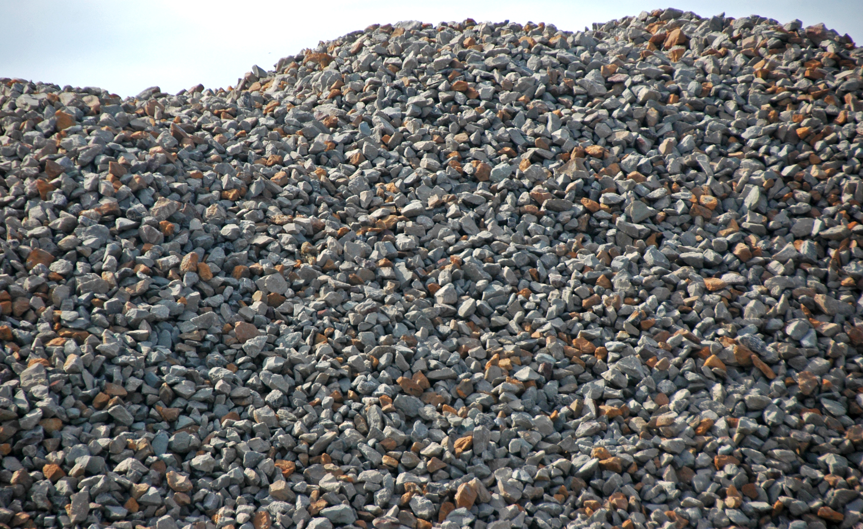 Rough face and crest of a crushed limestone stockpile near East Fultonham, Ohio