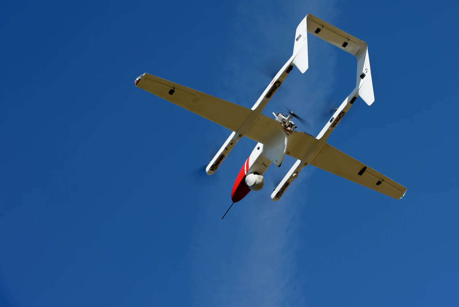 FVR90 fixed-wing VTOL uncrewed aircraft lifting off against a blue sky during a NASA ACERO test.