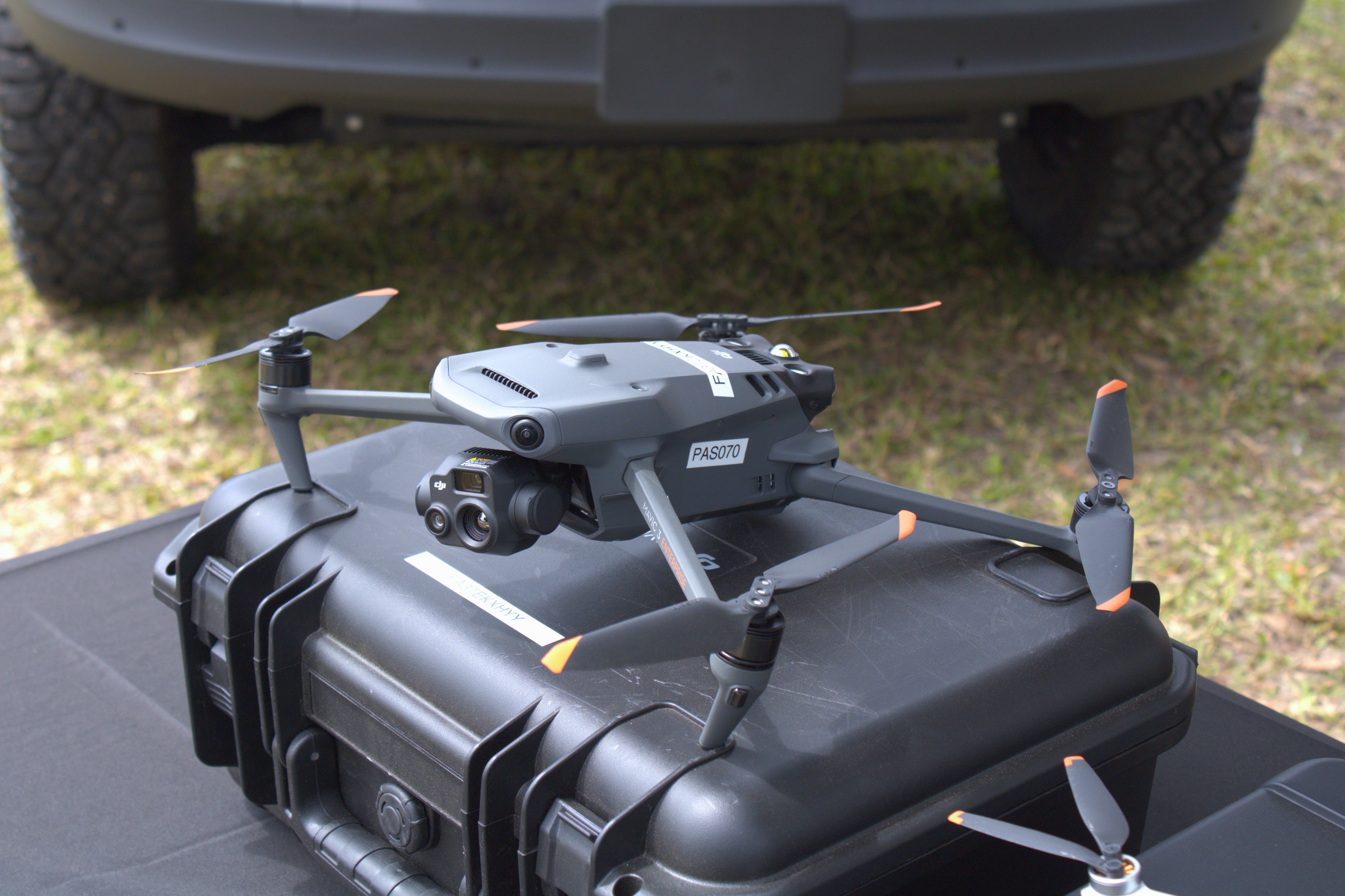 DJI Mavic 3T resting on a black equipment case with its front camera assembly visible